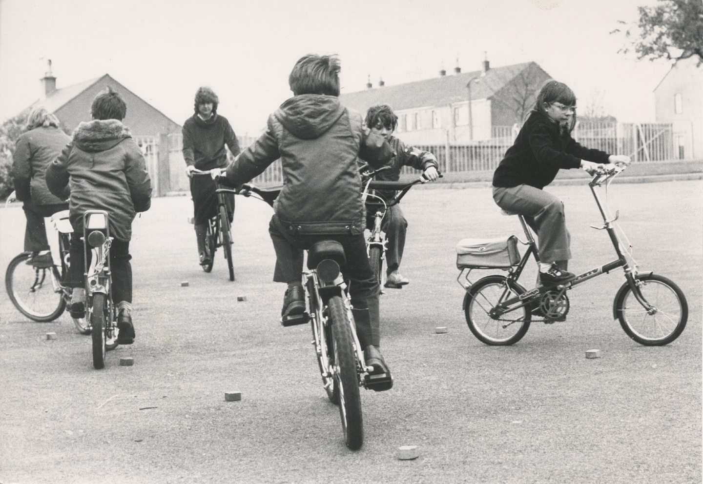 Youngsters improving their cycling skills by negotiating obstacles at Aberdeen in 1979 on the Raleigh Chopper.