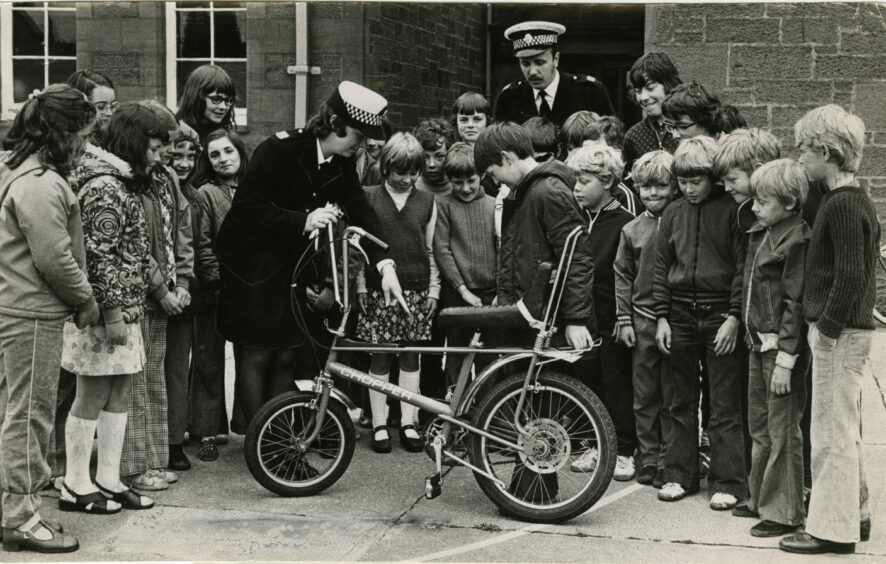 Children from Downfield getting cycle proficiency training from Tayside Police with a Raleigh Chopper in 1975.