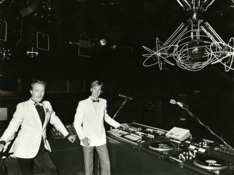 DJs show off the new lighting system at Night Magic in 1983.