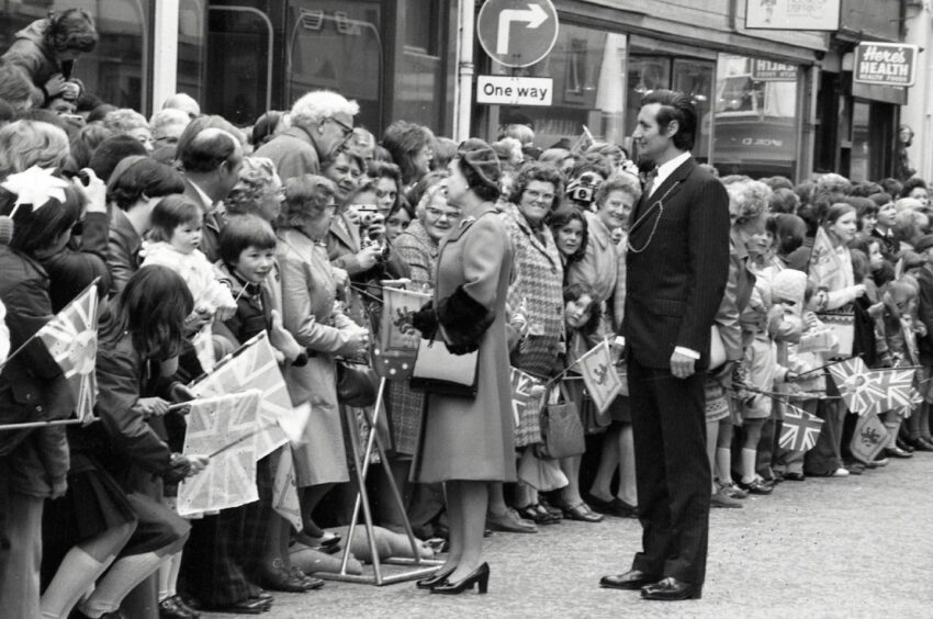 The Queen speaks to a crowd of well-wishers during her trip to Perth in 1977.