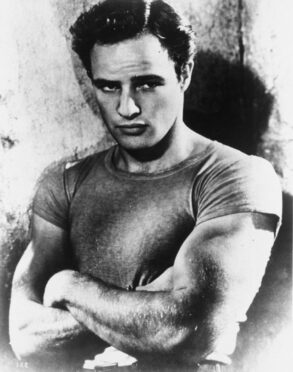 Marlon Brando wears a T-shirt as Stanley Kowalski in A Streetcar Named Desire.