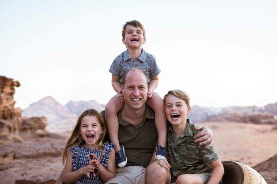 A new photo has been issued by Kensington Palace of the Duke of Cambridge with his children, Prince Louis, Prince George, right, and Princess Charlotte, to mark Father's Day 2022. The photograph was taken in Jordan in the autumn of 2021. Kensington Palace/PA Wire.