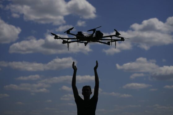 Oleg flies a drone while testing it on the outskirts of Kyiv, Ukraine