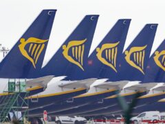 Ryanair jets parked up on the runway (PA)