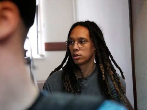 Brittney Griner is escorted to a court for a hearing on Friday (Alexander Zemlianichenko/AP)