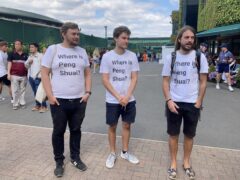 Protesters (left to right) Will Hoyles, 39, Caleb Compton, 27, and Jason Leith, 34, who all work for Free Tibet who have come to Wimbledon to draw attention to Peng Shuai (Rebecca Speare-Cole/PA)