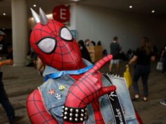 Mario Alcaraz of Los Angeles, dressed as Spider-Punk, attends day one of Comic-Con International (Invision/AP)