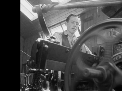 A Tartan weaver at Loch Carron features in an early BBC newsreel (BBC/PA)