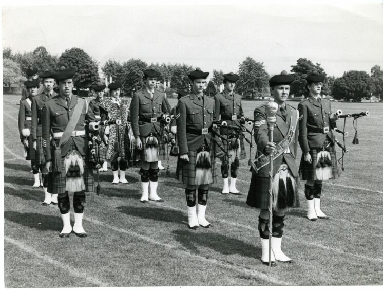 The pipe band are put through their paces.