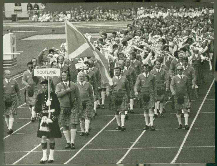 The Scotland team walk into Meadowbank at the Games in 1986.