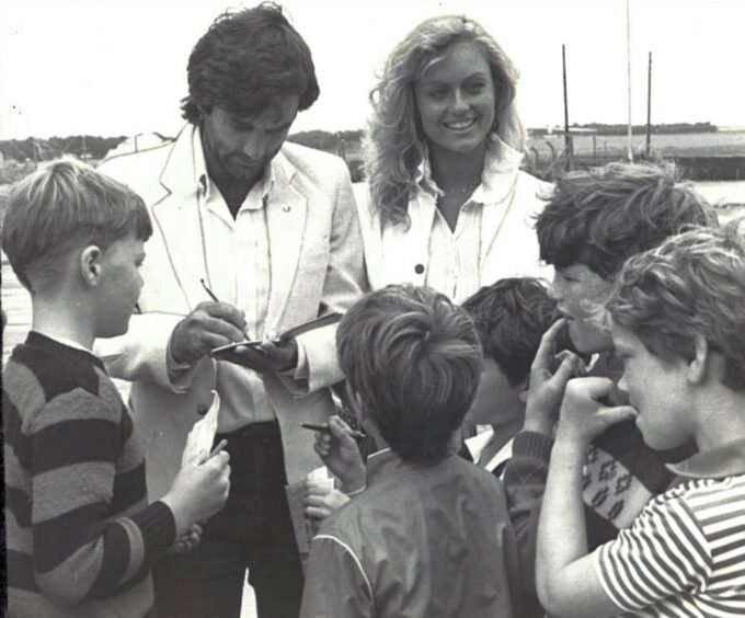 A magical moment as George Best and Mary Stävin sign autographs after the match at Gayfield in 1982.