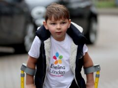 Tony Hudgell, who uses prosthetic legs, takes the final steps in his fundraising walk in West Malling Kent. Five-year-old Tony has raised more than �1,000,000 for the Evelina London Children’s Hospital, who have cared for him since he was four-months-old, by walking every day in June, covering a distance of 10 kilometres.