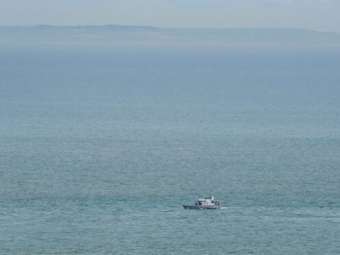A group of people thought to be migrants are brought in to Ramsgate, Kent, onboard a Border Force vessel following a small boat incident in the Channel. Picture date: Monday August 1, 2022. (Gareth Fuller/PA)