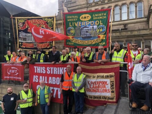 The picket line outside Liverpool Lime Street station (PA)