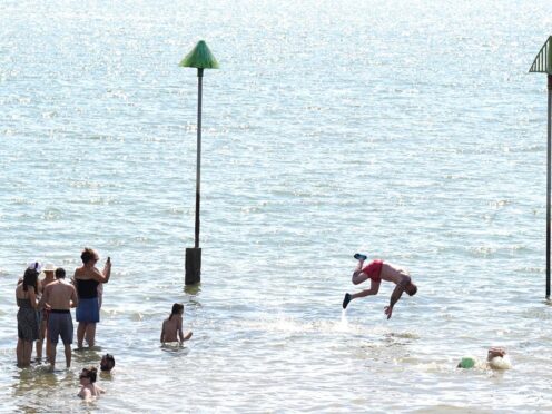 People gathered in the hot weather at Southend-on-Sea beach during the summer heatwave (Stefan Rousseau/PA)