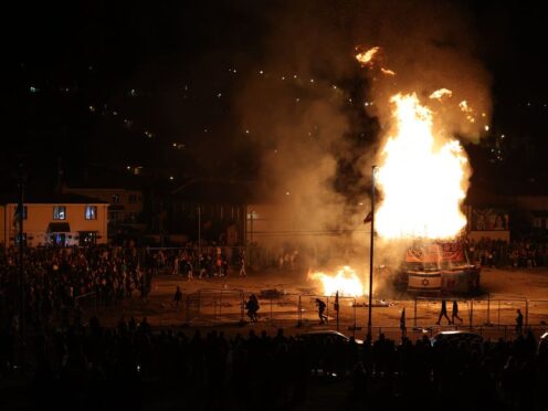 People gather at a nationalist bonfire in Londonderry (Liam McBurney/PA)
