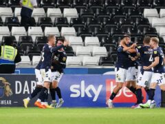 Millwall’s players celebrate their equaliser (PA)