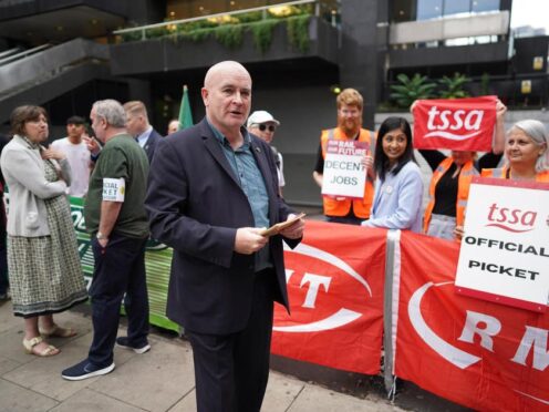 Mick Lynch, general secretary of the Rail, Maritime and Transport union, on the picket line outside London Euston train station (Stefan Rousseau/PA)