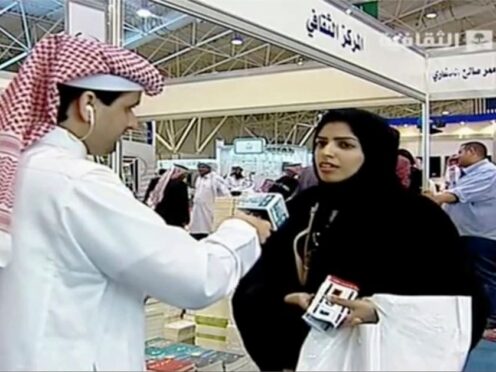 A screengrab from Saudi state television of doctoral student Salma al-Shehab speaking to a journalist in 2014 (Saudi state television via AP)