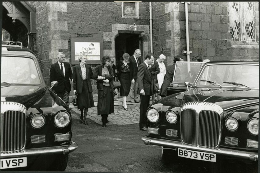 The family of Lynda Hunter leaving the church after her funeral.