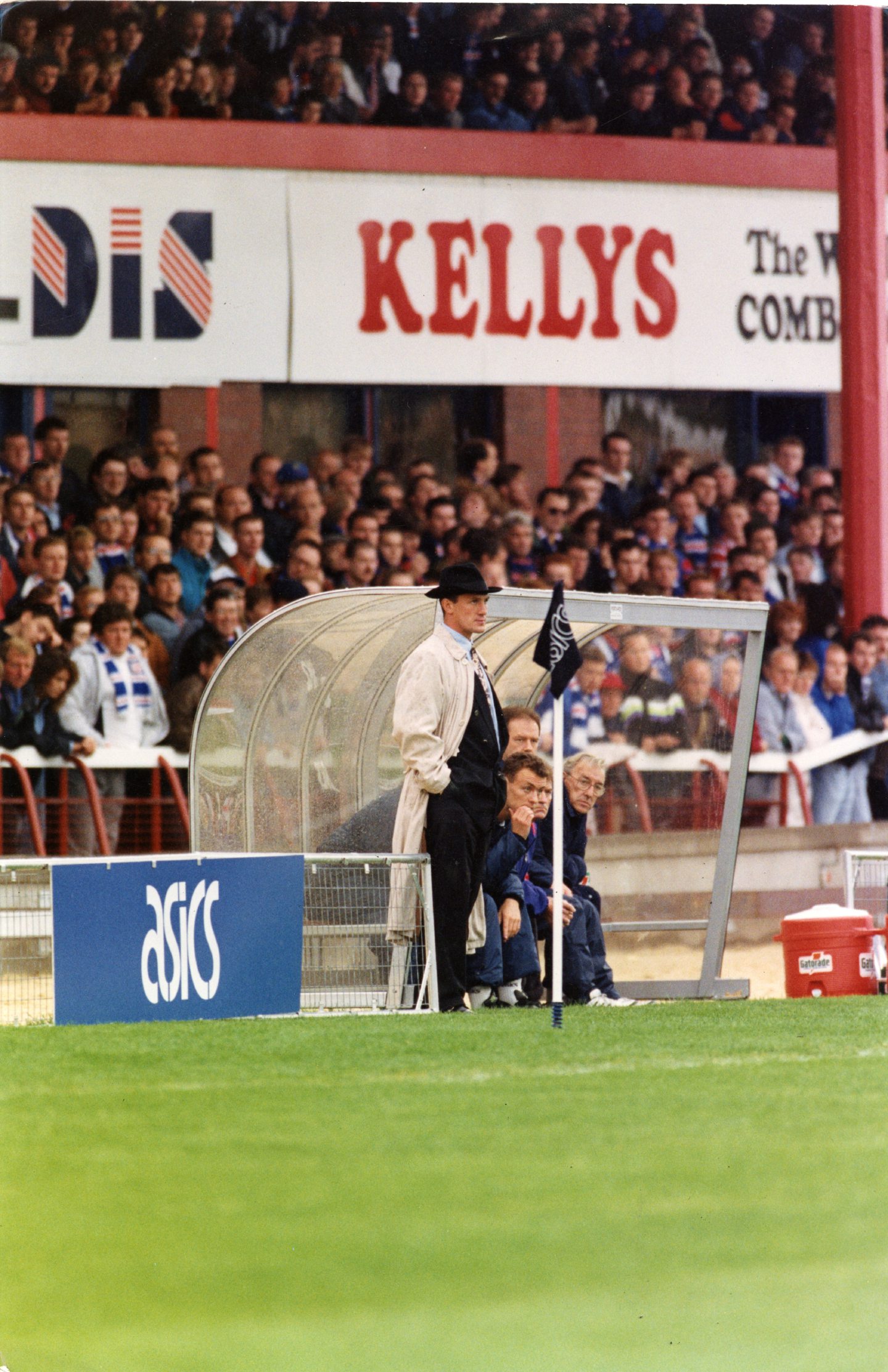 Simon Stainrod wearing a fedora on the touchline during the 4-3 victory against Rangers in 1992.