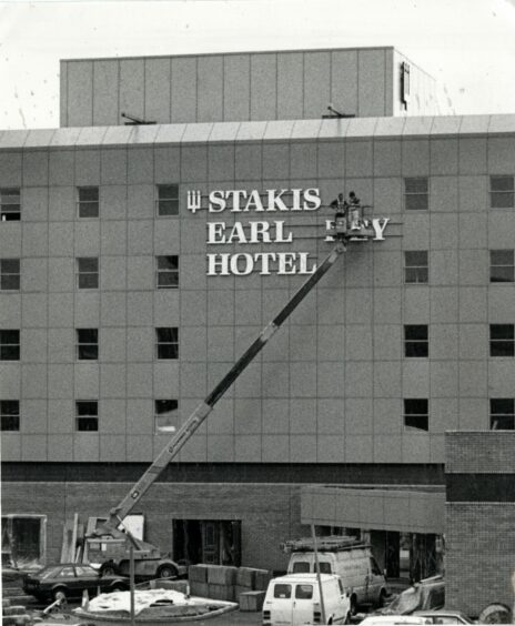 Workmen putting the finishing touches to the hotel frontage in July 1987.