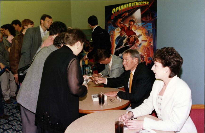 James Macpherson, Mark McManus and Blythe Duff sign autographs at the Odeon in Lochee. Image: DC Thomson.