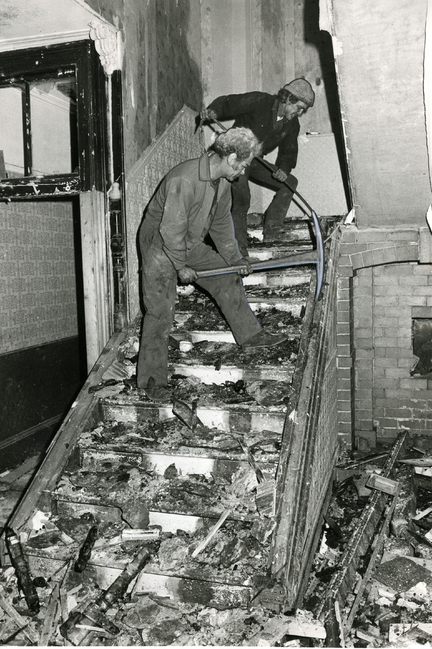 Alistair French and Ian Smith at work on the interior of the Harefield Road centre following the demolition order.