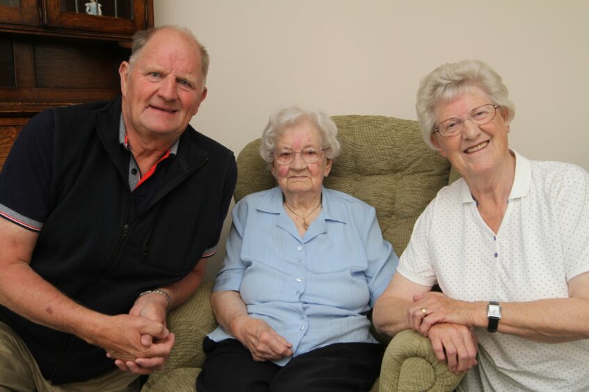 Lilian Morrison celebrating on her 100th birthday with son Donald and daughter Mary Thomson.