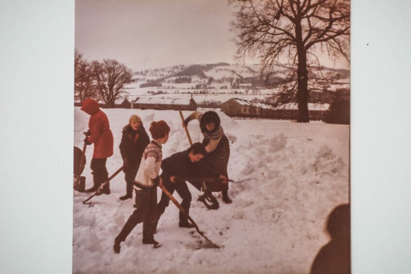 The children hard at work shovelling snow