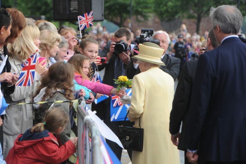 The Queen greets the public in Tay Street, Perth.