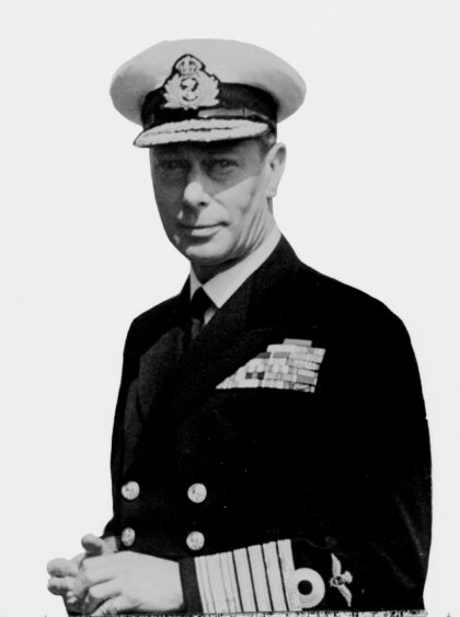 King George VI, in the uniform of the Admiral of the Fleet with pilot's wings.