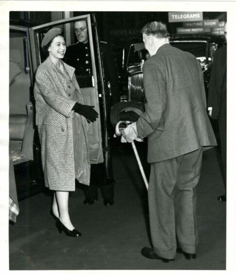 The Queen is greeted by Lord Kinnaird at Perth Station in 1958. 