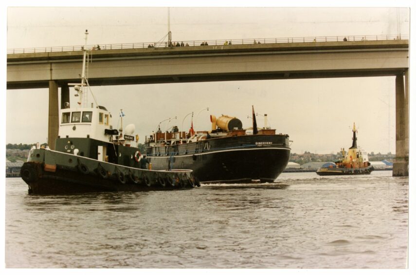 The Discovery's masts were taken down for the ship to go under the Tay Road Bridge, pictured. 