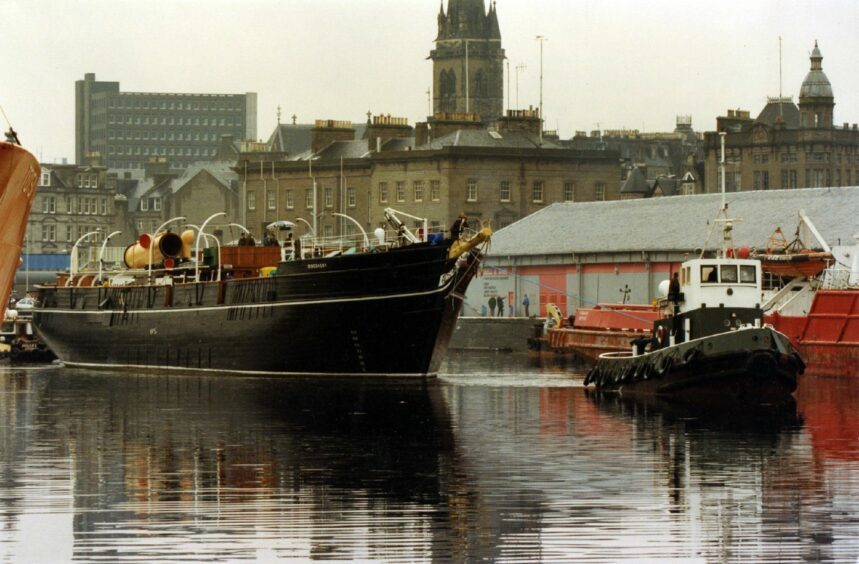 The Discovery begins its journey out of Victoria Dock.
