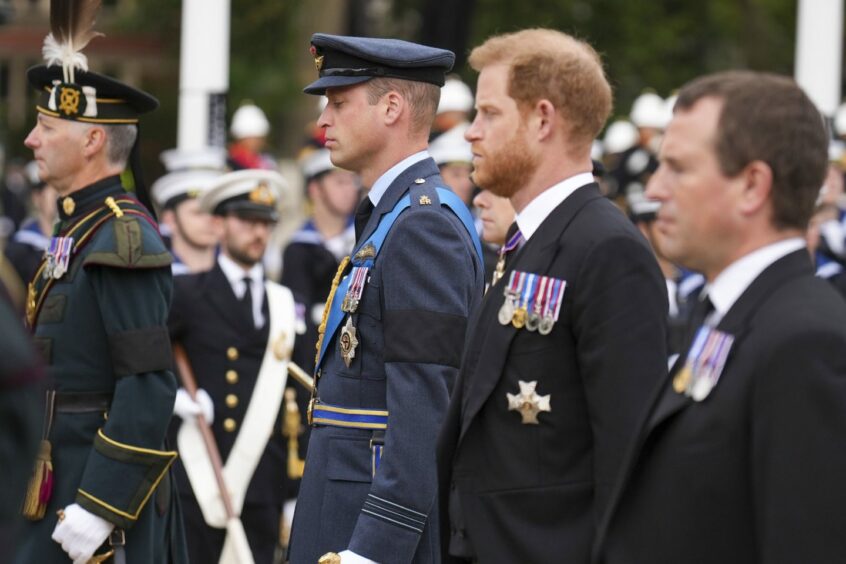 The Prince of Wales, the Duke of Sussex and Peter Phillips follow the State Gun Carriage carrying the coffin of Queen Elizabeth II.
