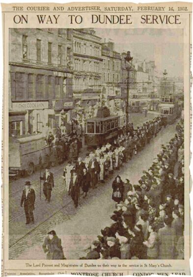 A newspaper clipping showing mourners on the way to a service in tribute to King George VI
