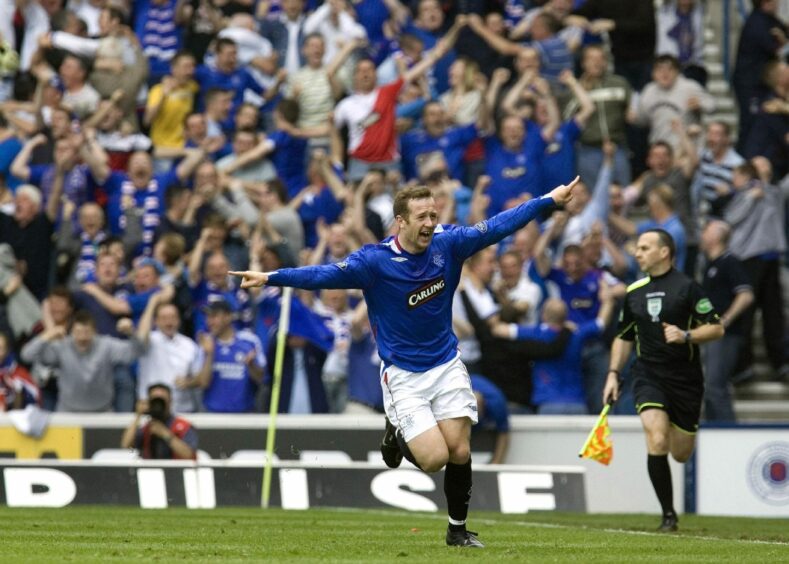 Rangers' Charlie Adam celebrates his cheeky free-kick strike against Celtic at Ibrox in May 2007.