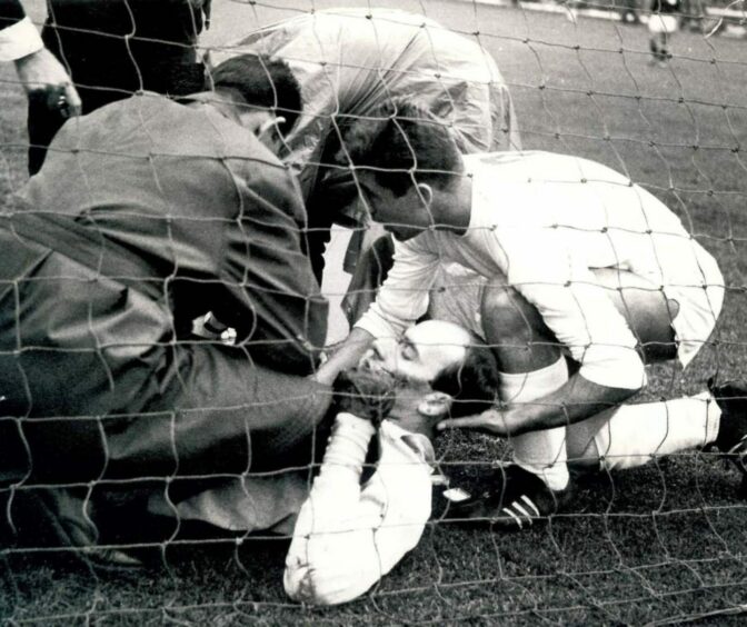 The German keeper receives attention after being injured in the first minutes of the match.