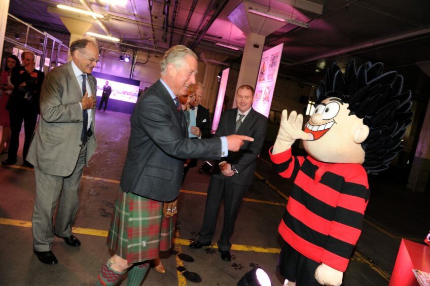 Dennis the Menace manages to leave the heir to the throne in a fit of giggles in 2013.