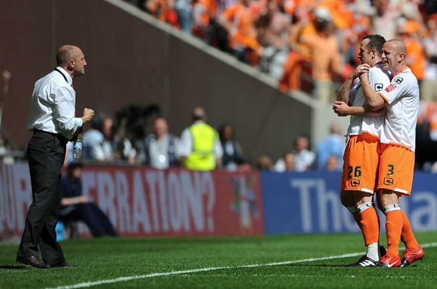 Blackpool boss Ian Holloway salutes his opening goalscorer Charlie Adam in the play-off final.