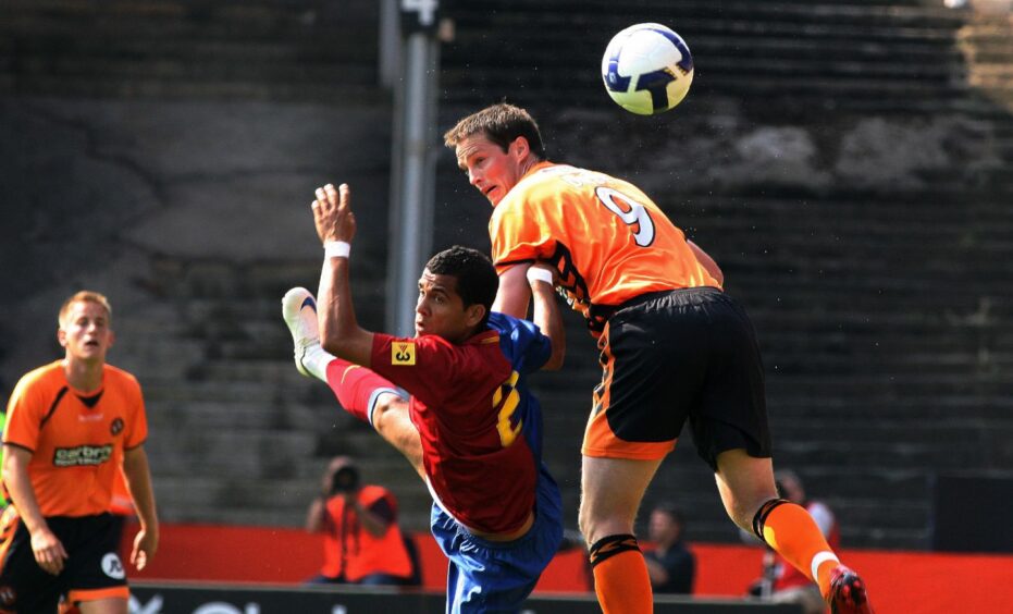 Dani Alves goes up against Jon Daly in the Tannadice friendly.