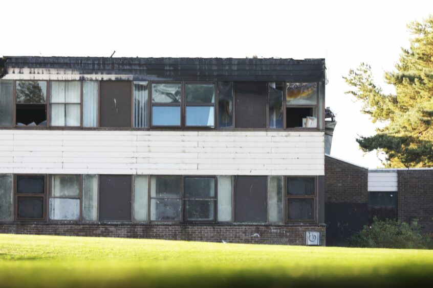 The school's roof and top floor were badly damaged. 