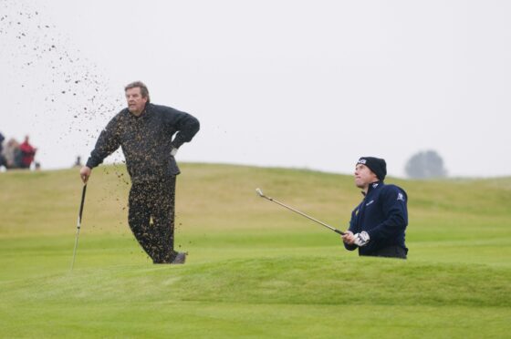 Johann Rupert playing with Lee Westwood at the Dunhill Links.