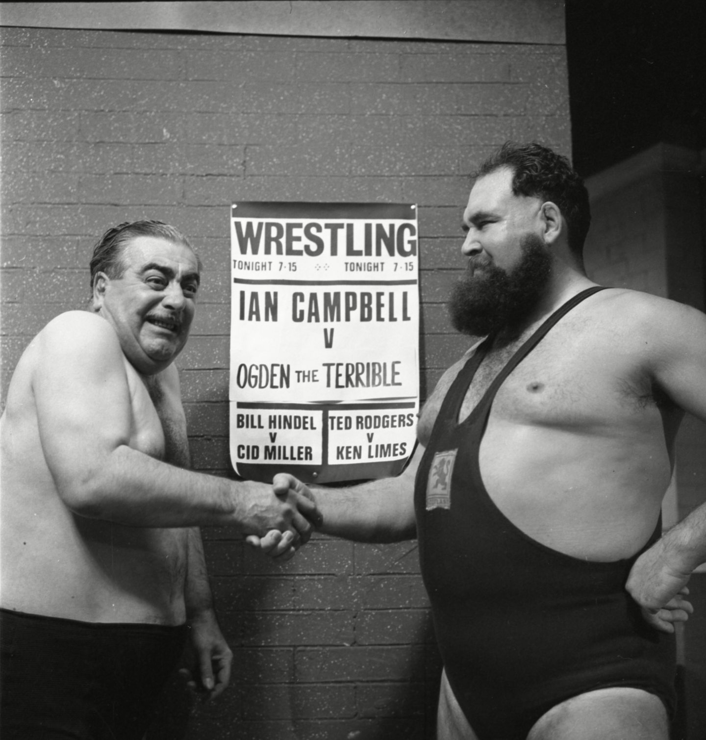 Stan Ogden shakes hands with Ian Campbell before their wrestling match in Coronation Street. Image: ITV/Shutterstock.