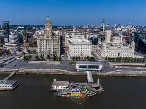A aerial view of The Liverpool waterfront with a Mersey Ferry at the ferry terminal. The city region is expecting a financial boost from hosting Eurovision (Peter Byrne/PA)