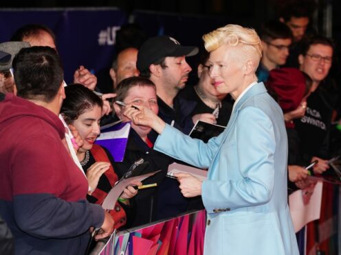 Tilda Swinton signs autographs as she arrives for the UK premiere of The Eternal Daughter during the BFI London Film Festival 2022 at the Royal Festival Hall, Southbank (Ian West/PA)