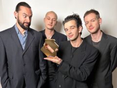 The 1975 (L-R Ross MacDonald, George Daniel, Matty Healy and Adam Hann) pose with their Official Number 1 Award from the Official Charts Company for Being Funny In A Foreign Language (Official Charts Company/PA)