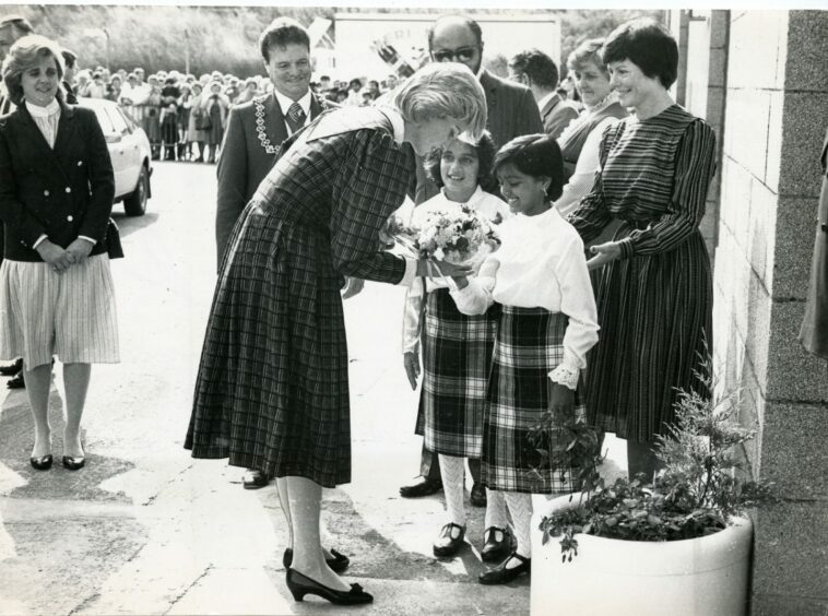 The Princess of Wales receiving posies from Talkeen and Aeyesha Okhai at Keiller's Factory