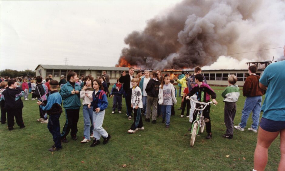 Crowds watching the fire at the school.